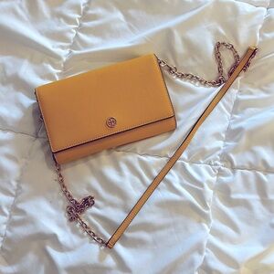 Tory Burch wallet on a chain bag yellow with gold hardware.